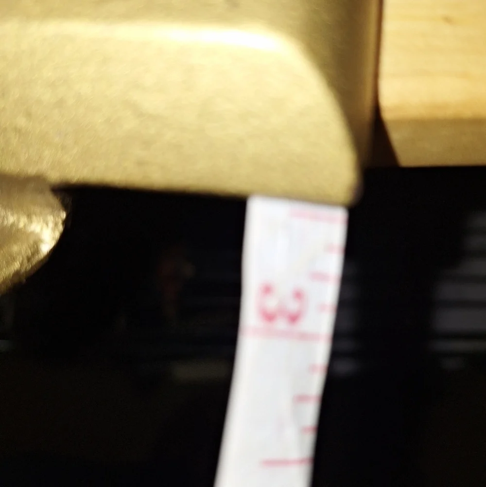 An unbranded Santa Clause Stocking Holder. Its base is 3.75